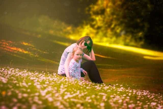 Photo of mother sitting with child outside. Counseling for moms Houston, TX 77006