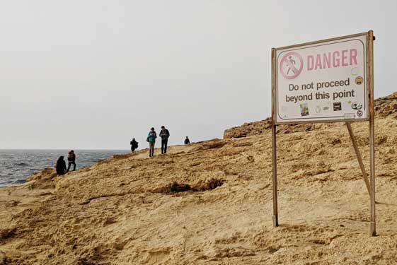 Photo of a sign at the beach saying danger to illustrate cognitive behavioral therapy for OCD in Houston, Texas