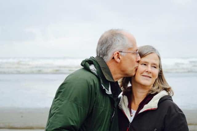 Image of man kissing woman to show help for family members of OCD treatment for OCD Houston, Texas