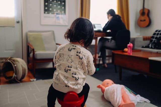 Photo of woman working to show the mental load of mothers