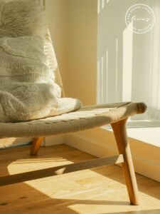 Comfortable therapy chair in a calm, softly lit office, representing a safe space for infertility and pregnancy loss counseling in Houston